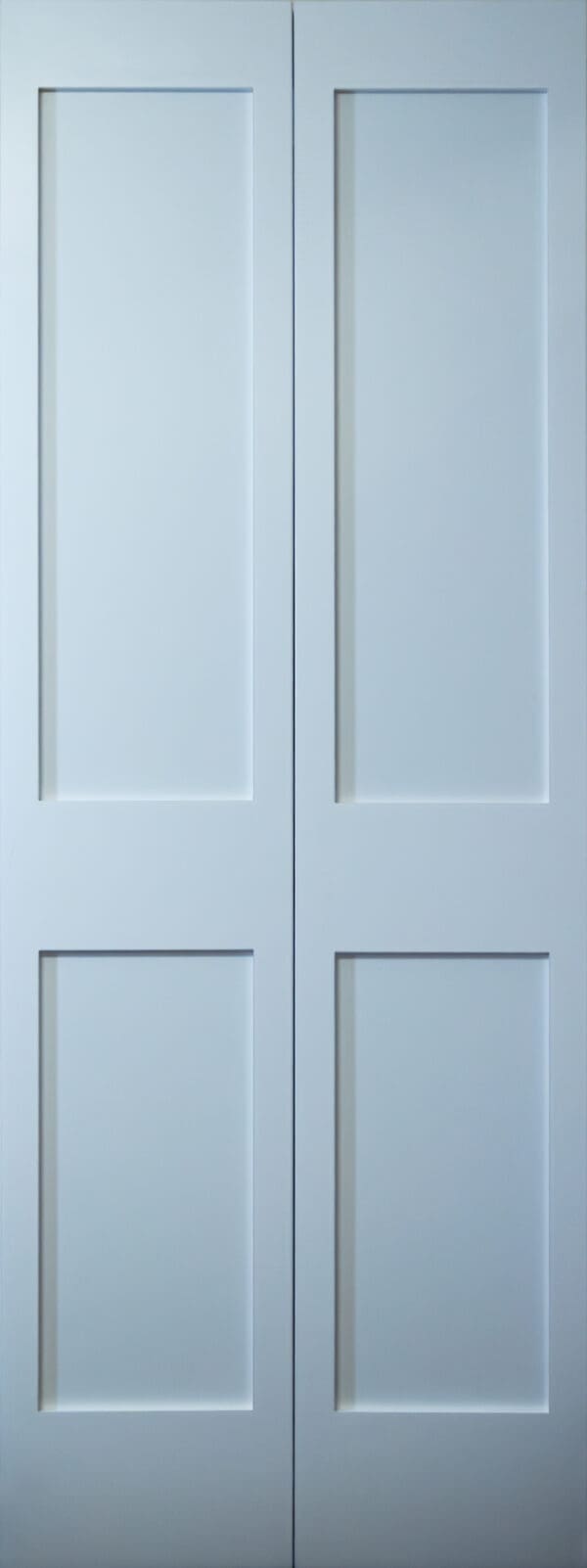 White four-panel wooden door closed.